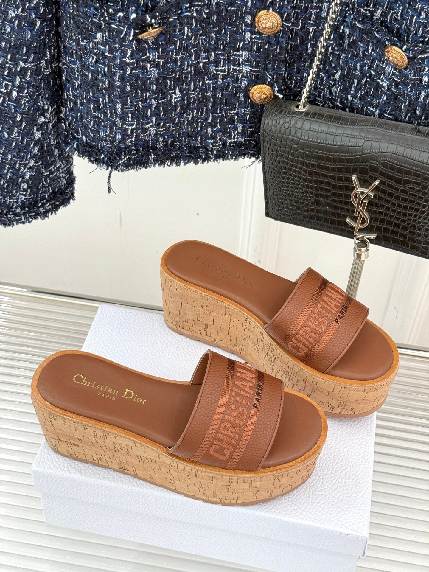 Tan open-toe slide sandals with cork wedge and logo strap