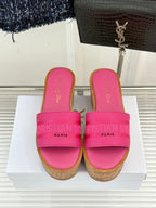 Pink Dior platform slide sandals, front view, wide strap on cork-look sole
