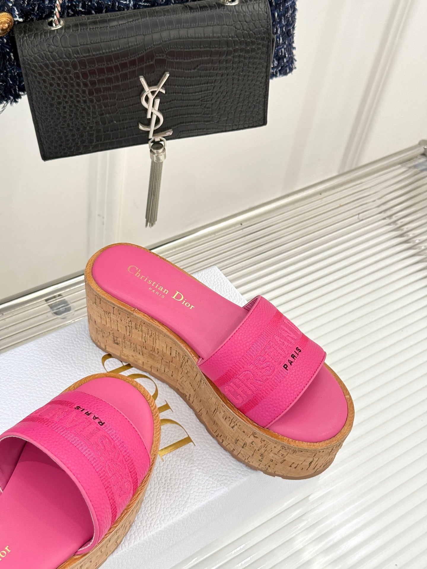 Pink Dior platform slide sandals with thick strap and cork-look wedge sole