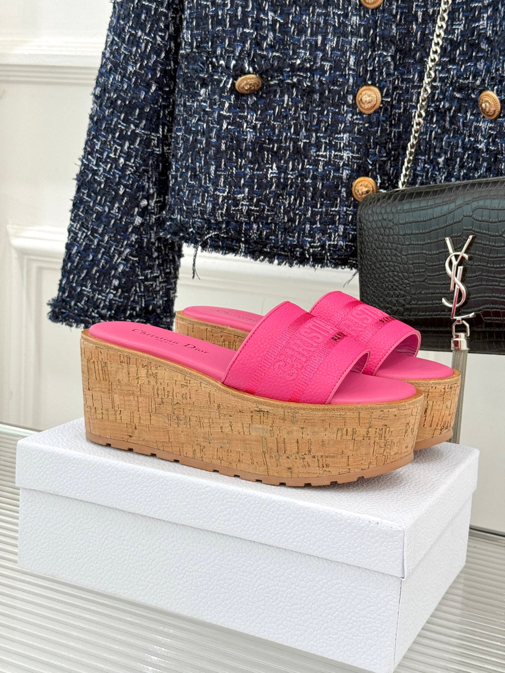Pink Dior platform slide sandals with wide textured strap and cork-look wedge