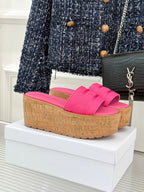 Pink Dior platform slide sandals with wide textured strap and cork-look wedge