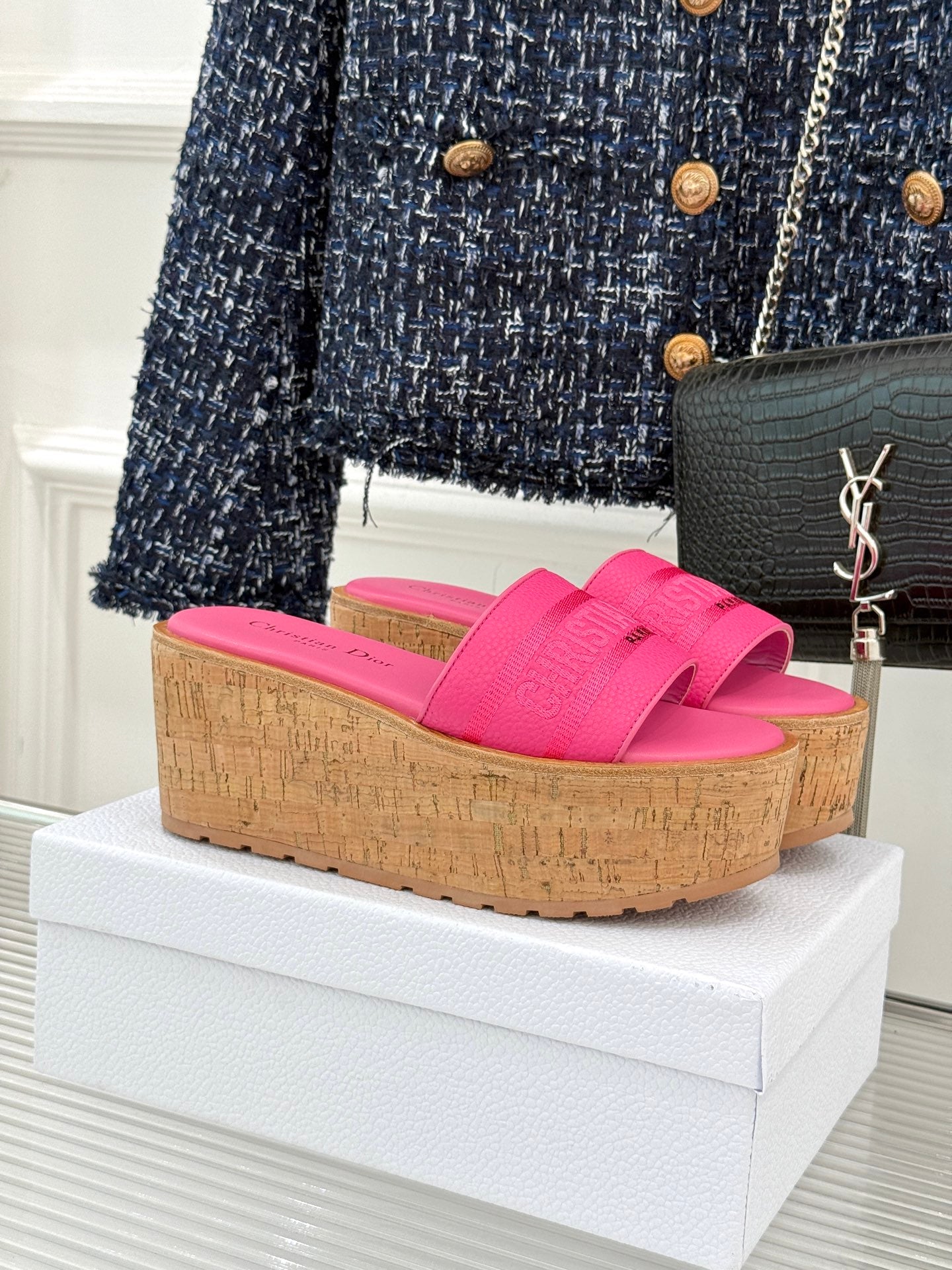 Pink Dior platform slide sandals with wide textured strap and cork-look wedge