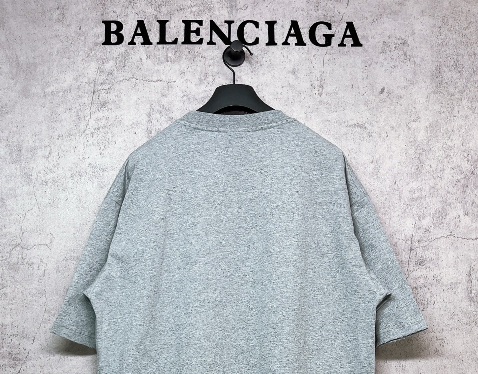 Balenciaga heather gray T-shirt, back view on hanger