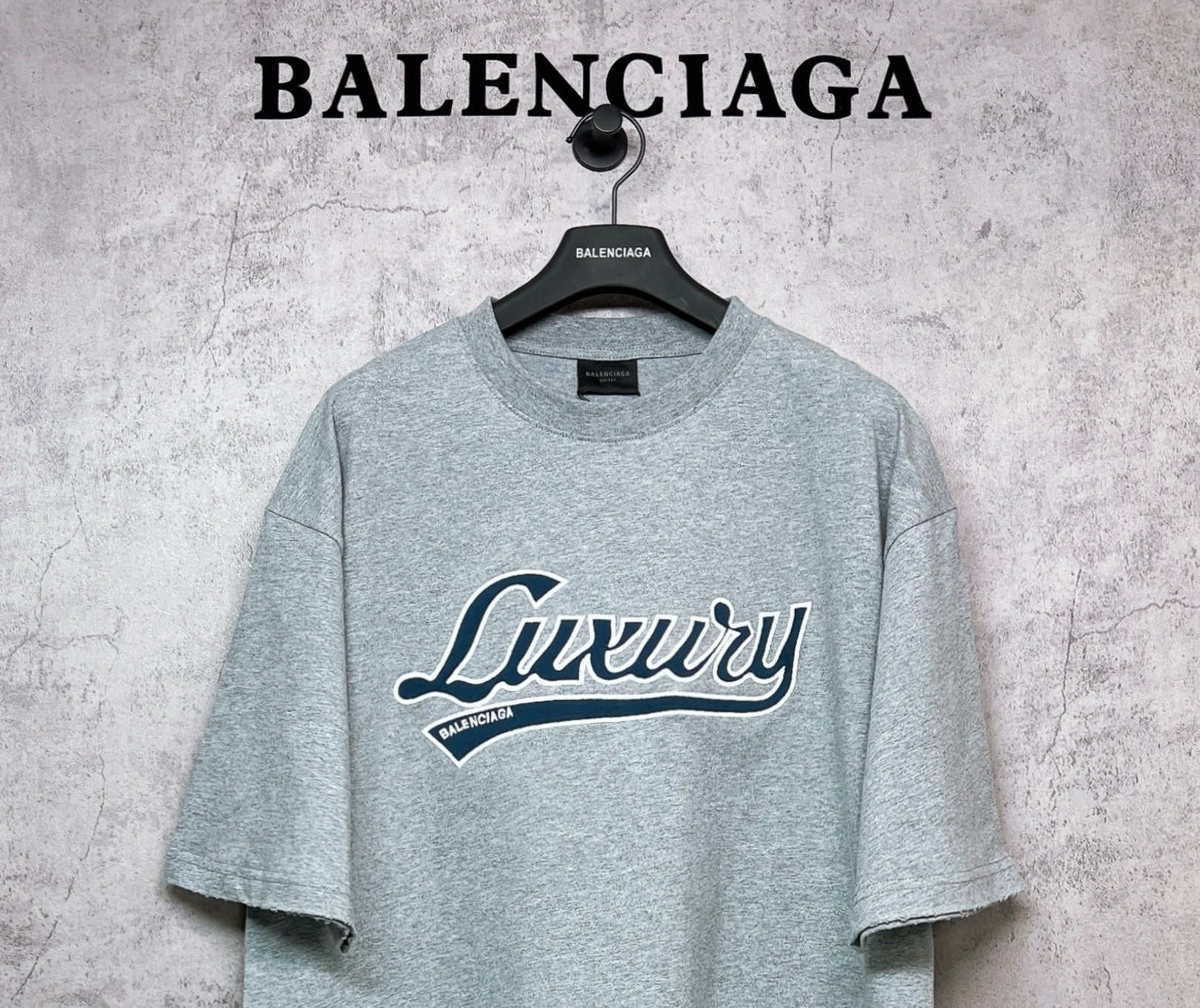 Balenciaga heather gray T-shirt with “Luxury” script logo graphic