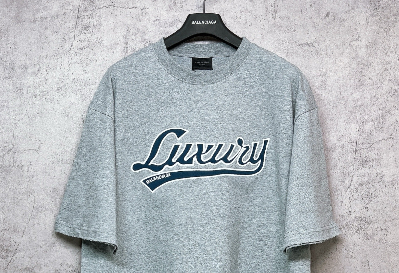 Balenciaga heather gray T-shirt with large “Luxury” logo graphic