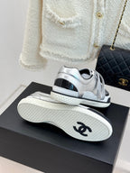 Chanel sneakers heel and sole view in metallic silver with textured outsole tread