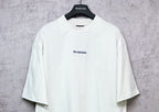 White crew-neck T-shirt with small BALENCIAGA chest print, short sleeves.