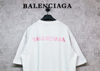 White short-sleeve crewneck T-shirt with pink BALENCIAGA logo on back