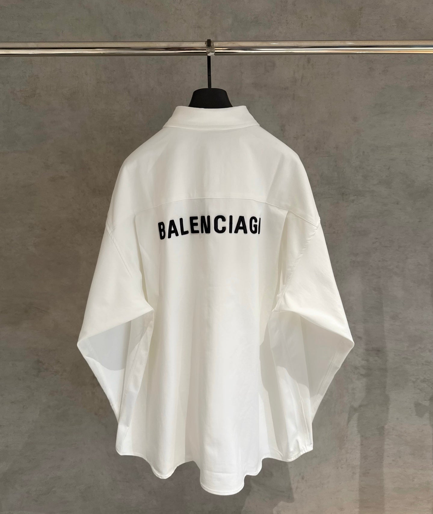 White long-sleeve shirt with BALENCIAGA text on back