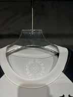 White raglan T-shirt neckline with faint circular logo