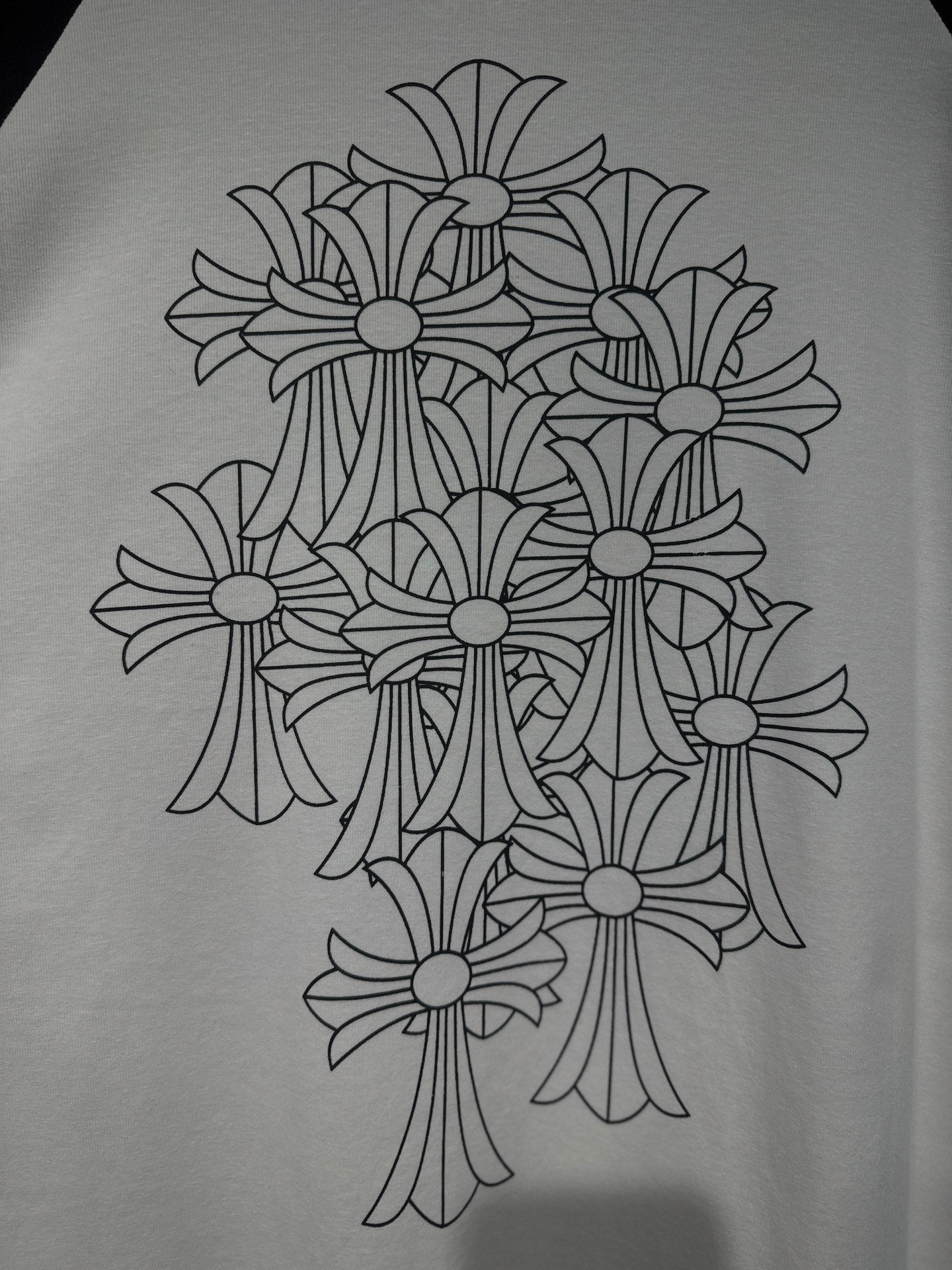 Floral bouquet line-art graphic on white raglan shirt