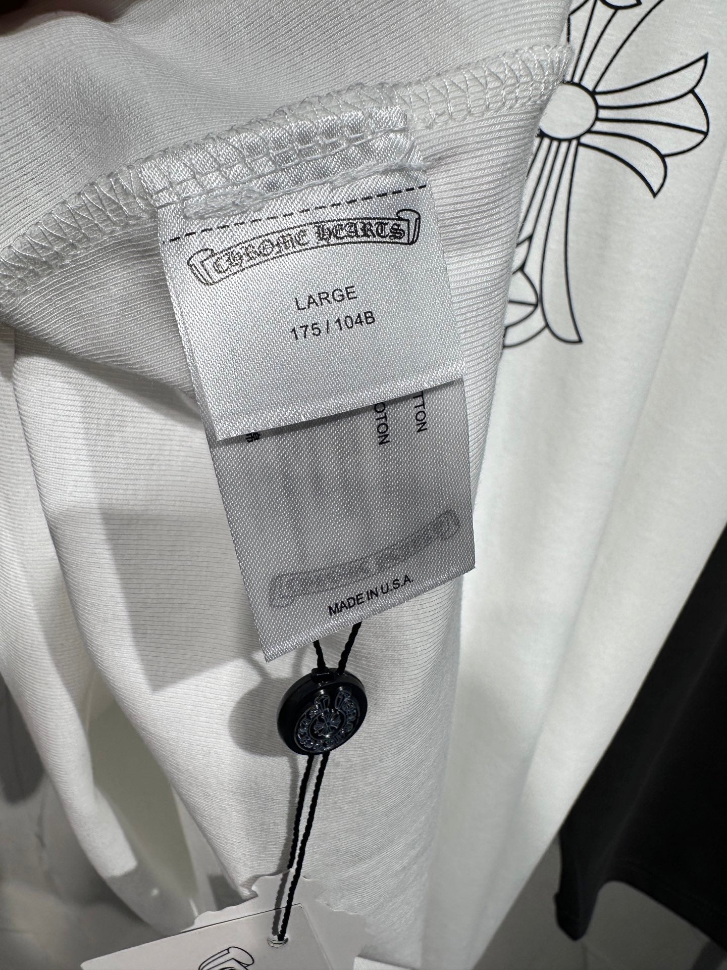 Light gray long-sleeve shirt neckline with inner size label and button