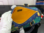 Louis Vuitton bag interior with yellow lining and zip pocket