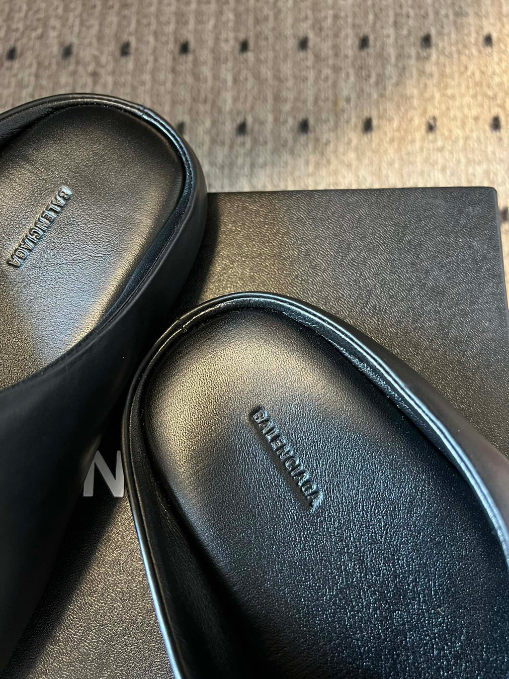 Balenciaga slide sandal insole close-up with embossed brand text