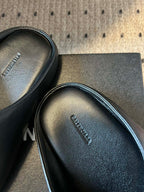 Balenciaga slide sandal insole close-up with embossed brand text