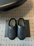 Balenciaga logo slide sandals, dark leather uppers on a box