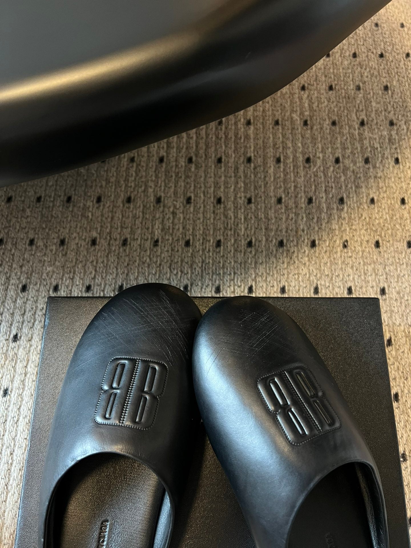 Balenciaga logo slide sandals, dark leather with embossed logo on uppers