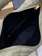 Sage green hobo bag interior view with navy lining and zip compartment