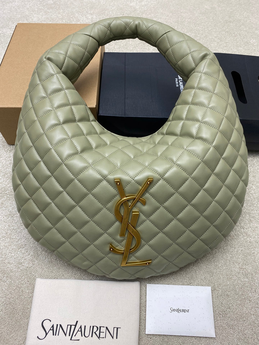 Sage green quilted hobo bag with gold YSL logo at front