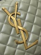 Gold YSL logo on sage green quilted hobo bag