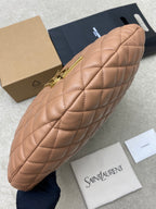 Quilted hobo bag with gold zipper and hardware, tan leather, angled side view