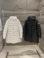 Long puffer coat in white and black, hooded with button front