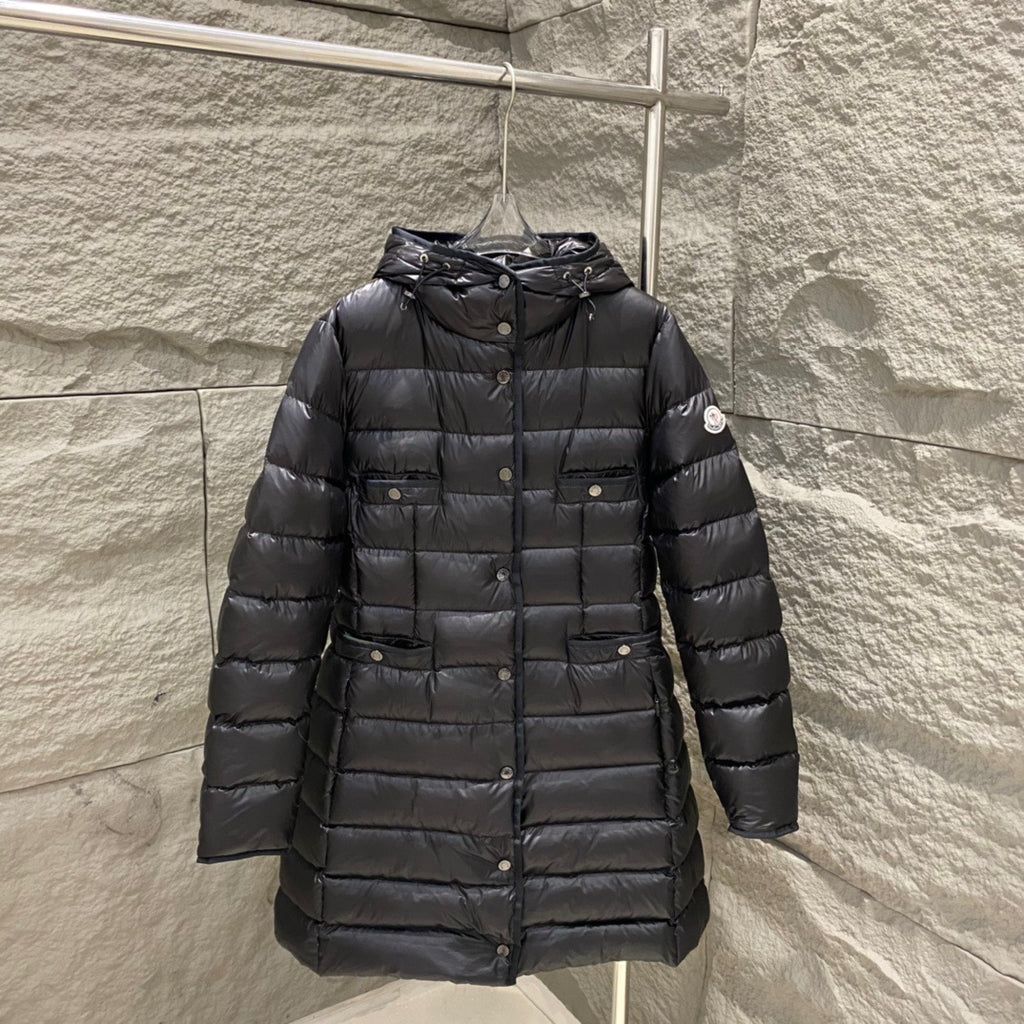 Black hooded long puffer coat with quilted panels and button front
