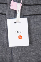 Gray Dior hoodie knit with front seam detail and hanging white retail tag