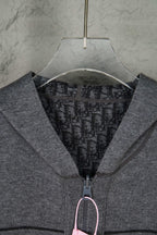 Gray Dior zip hoodie close-up of hood opening and front zipper pull