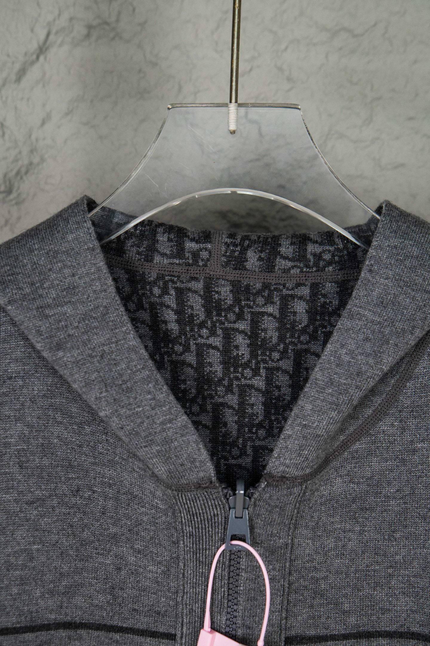 Gray Dior zip hoodie close-up of hood opening and front zipper pull