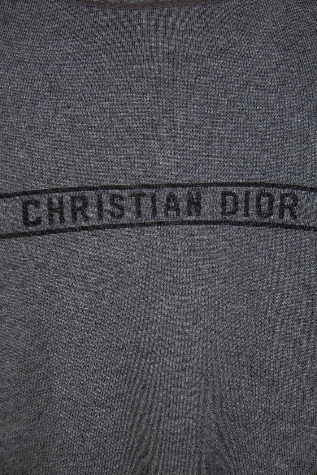 Gray Dior logo band reading “CHRISTIAN DIOR” across the chest