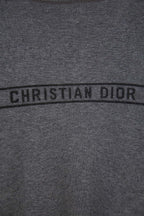 Gray Dior logo band reading “CHRISTIAN DIOR” across the chest