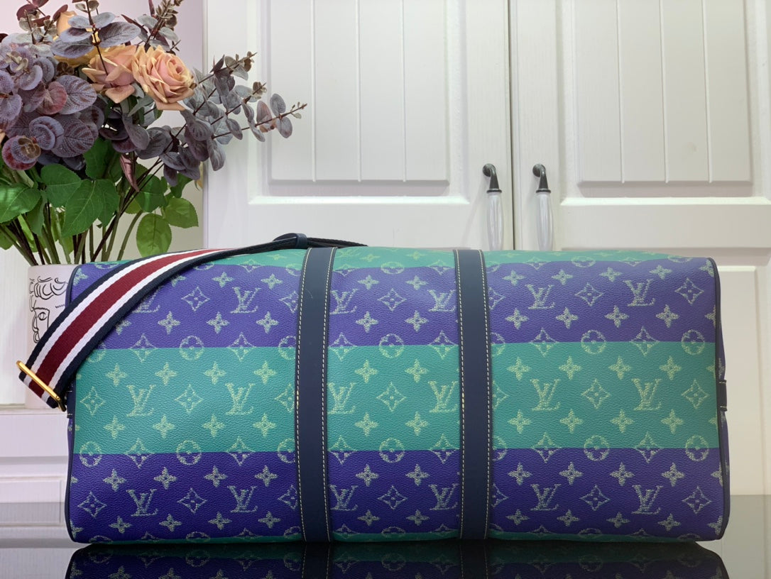Men's duffel bag with multicolor monogram print and striped strap, front view