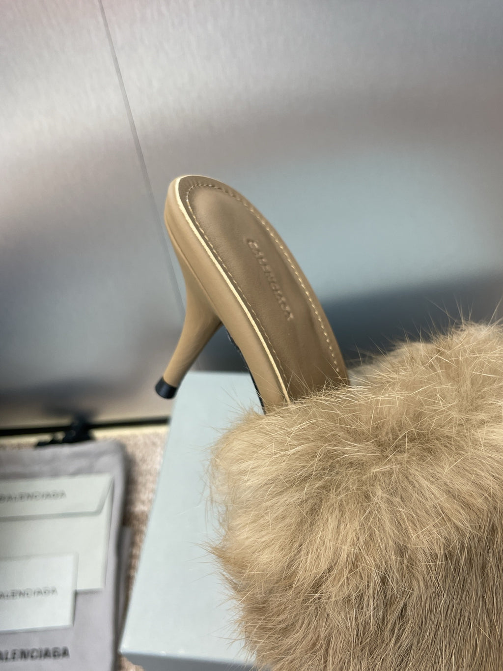 Light beige faux-fur slide sandal with beige leather heel and stiletto