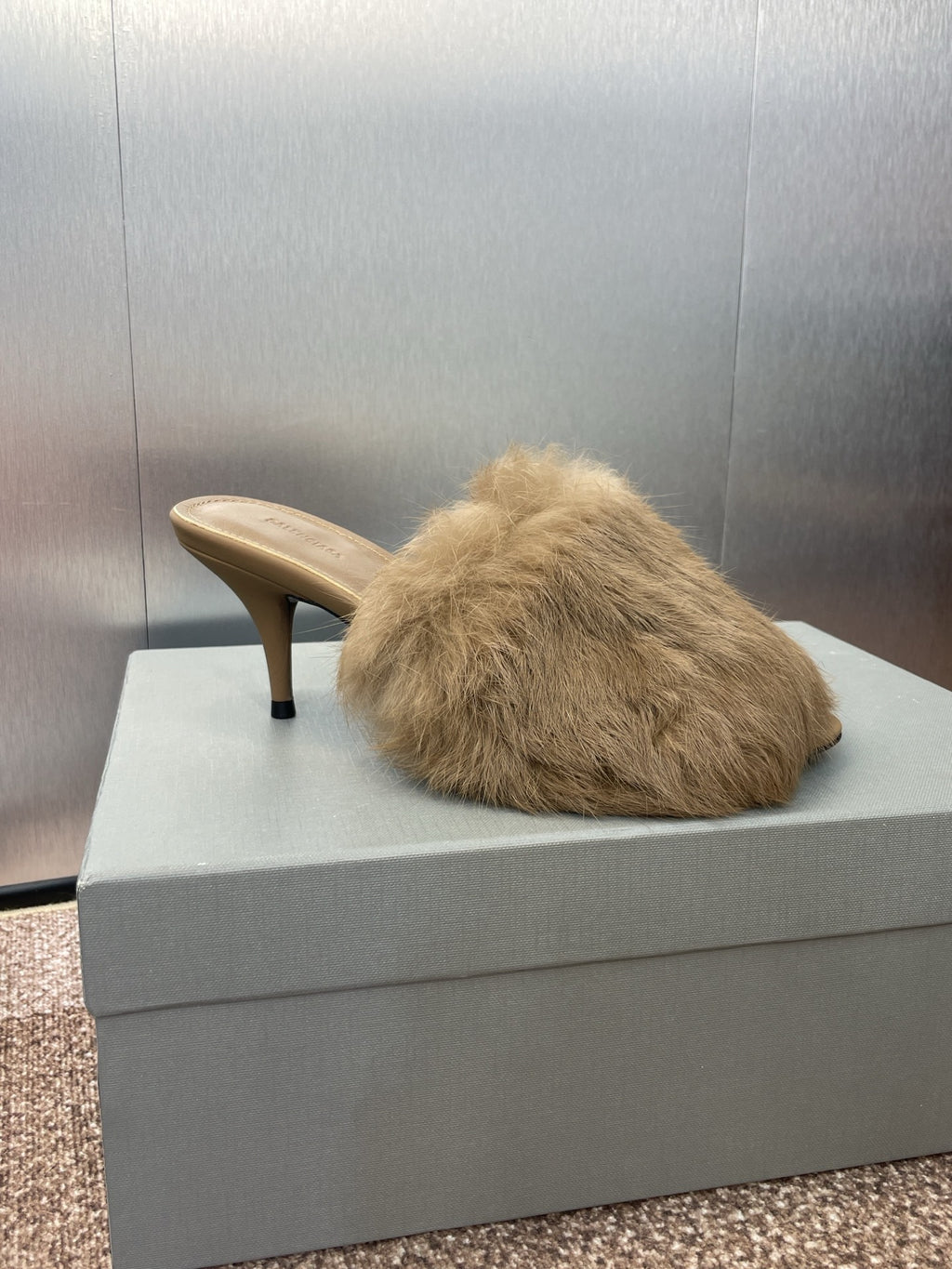 Light beige faux-fur mule sandal with slim stiletto heel and curved toe