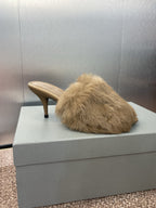 Light beige faux-fur mule sandal with slim stiletto heel and curved toe