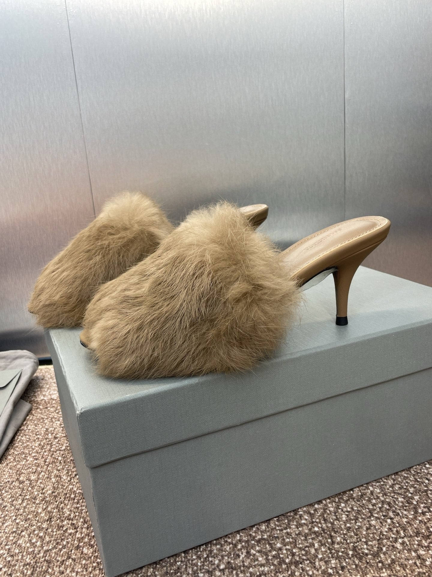 Light beige faux-fur mule sandal with slender heel, open-back slip-on