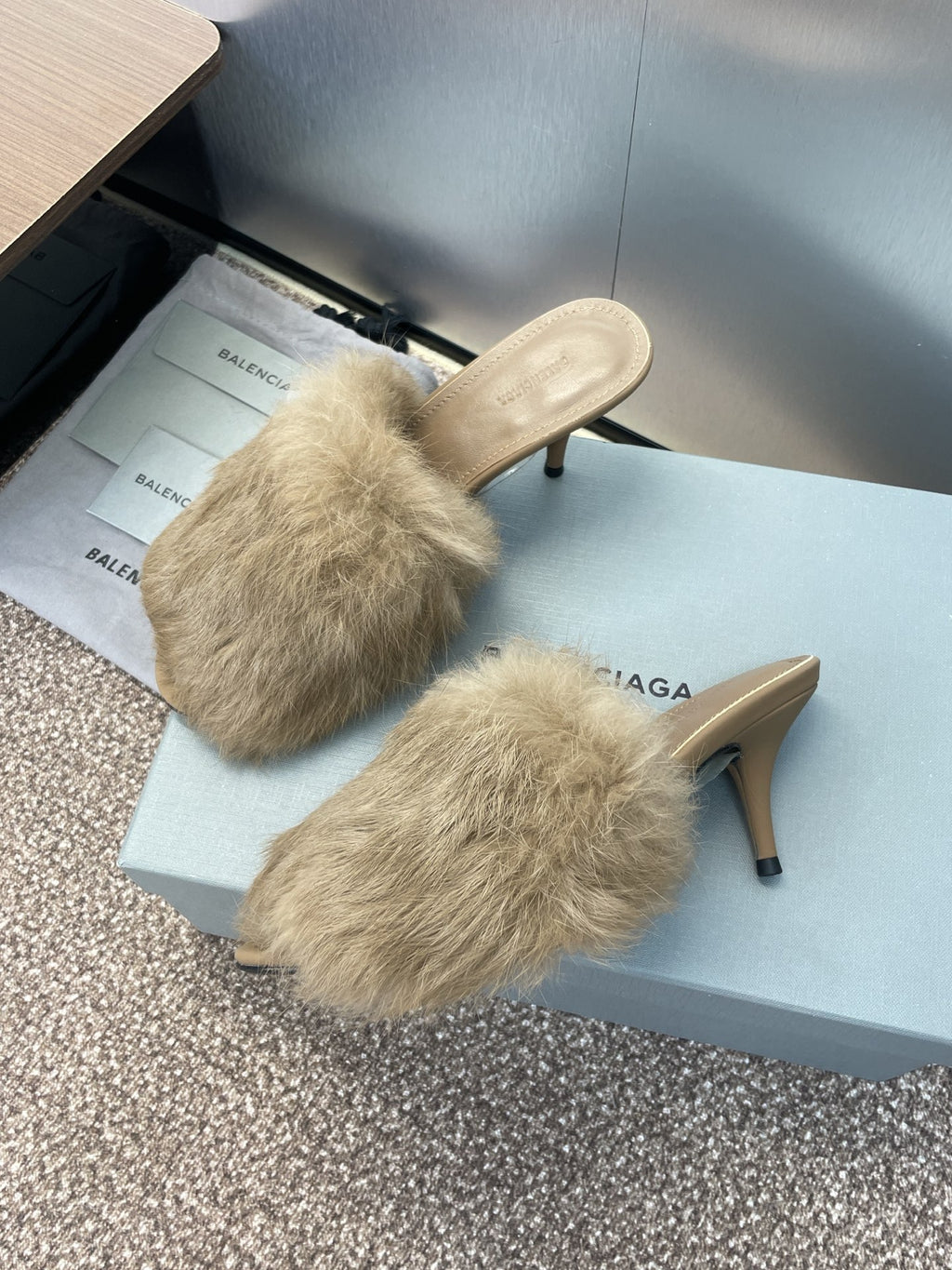 Light beige faux-fur mule sandals with slim stiletto heels and beige footbeds