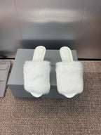 White faux-fur slide sandals with slim stiletto heel, open toe.