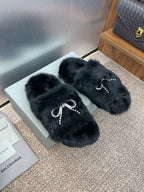 Balenciaga black faux-fur slide sandals with rhinestone bow embellishment