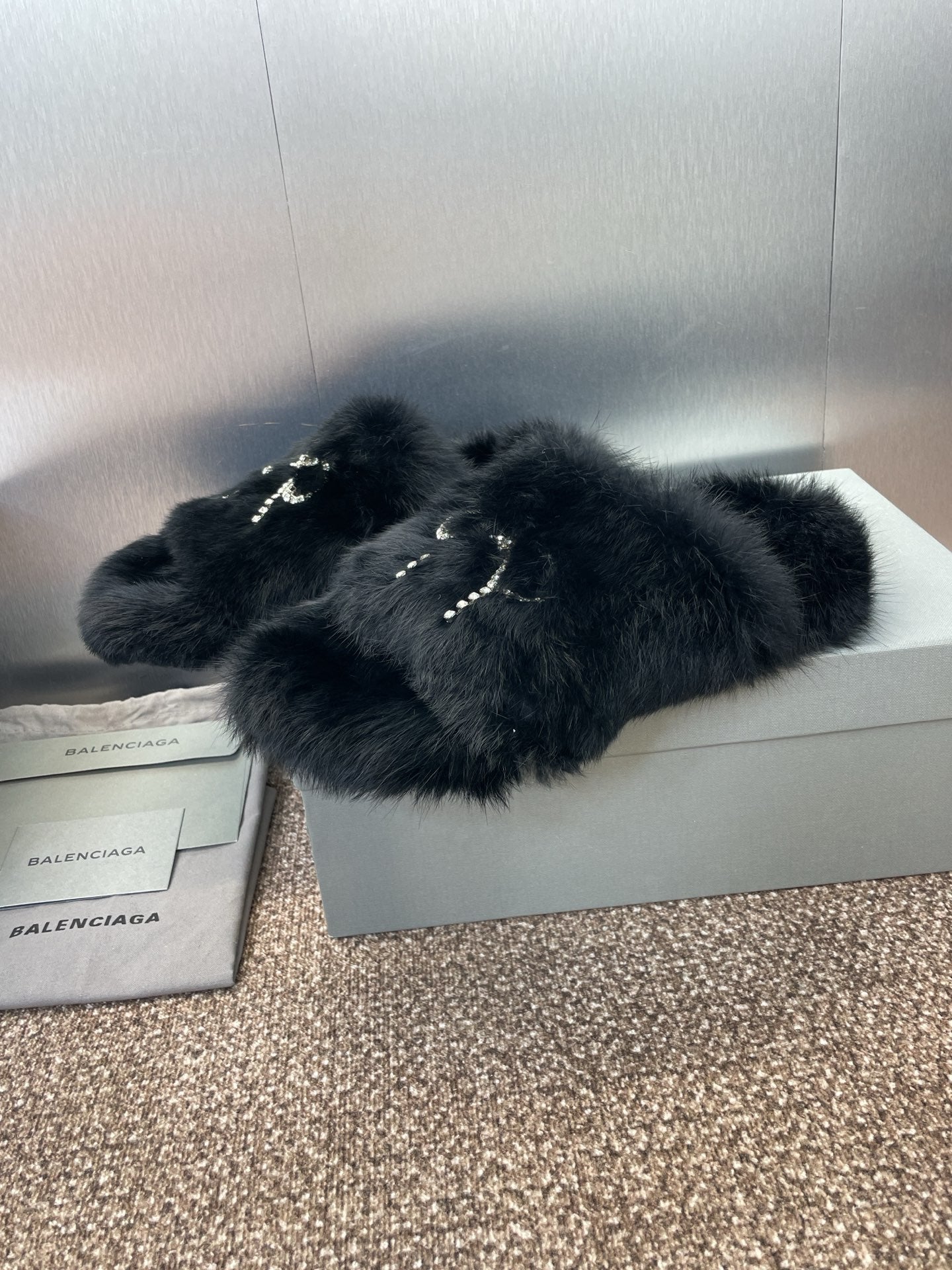 Balenciaga black fur slide sandals with rhinestone bow strap detail