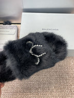 Balenciaga black fur slide sandals with rhinestone bow and chain drops