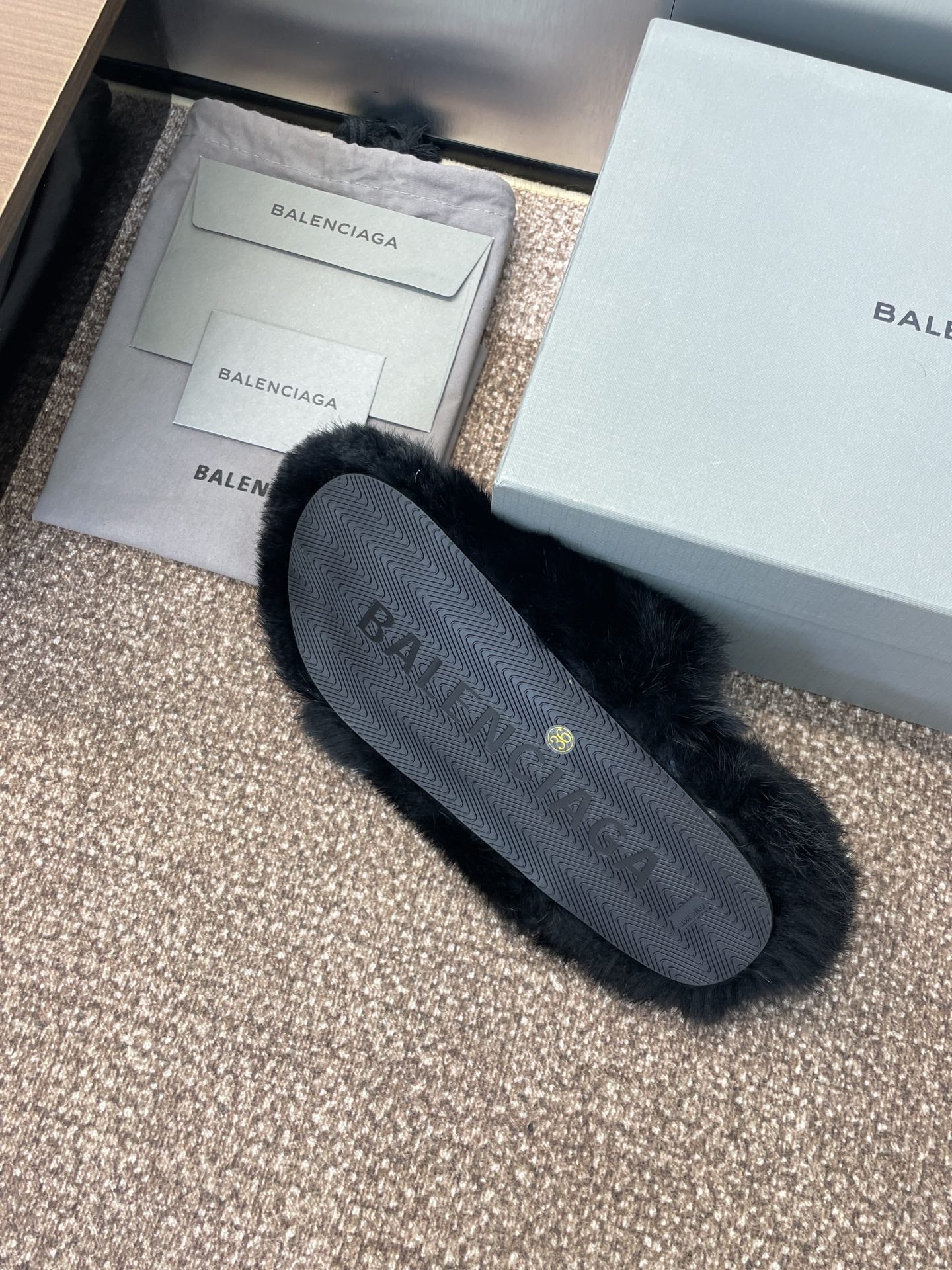 Balenciaga black fur slide sandal sole with logo on outsole