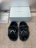 Balenciaga black fur slide sandals with rhinestone bow detail