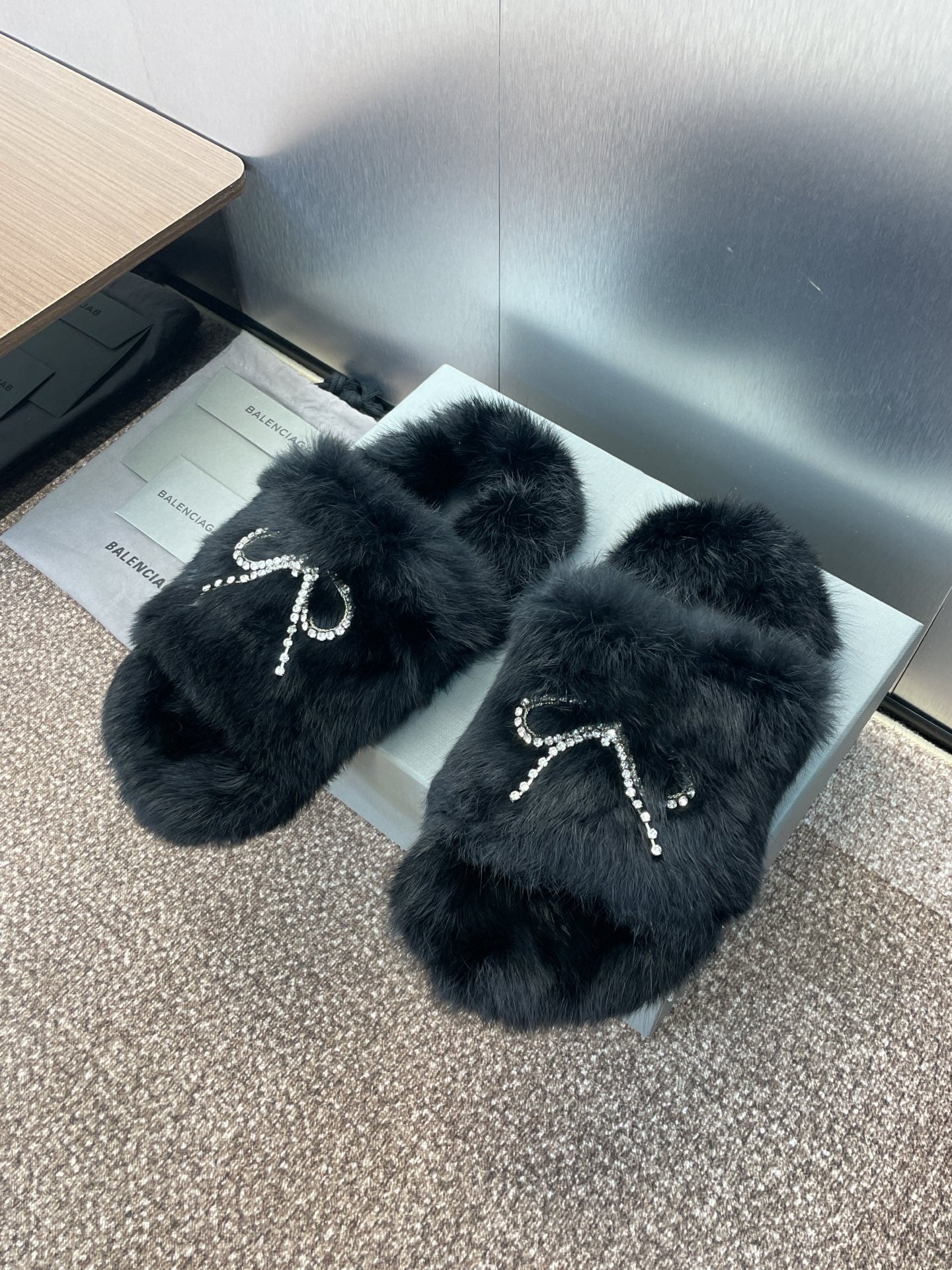 Balenciaga black fur slide sandals with crystal bow and dangling chain