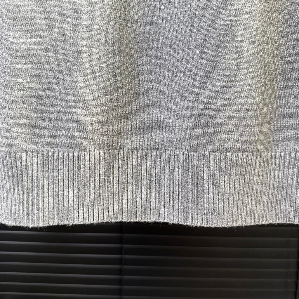 Gray ribbed knit sweater hem edge