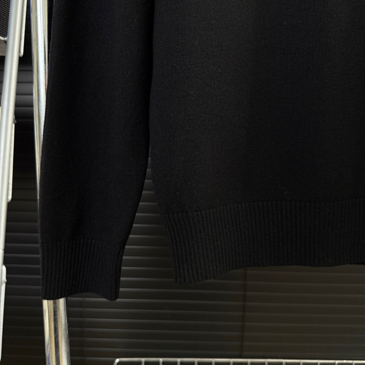 Black Moncler sweater sleeves and ribbed hem cuff detail