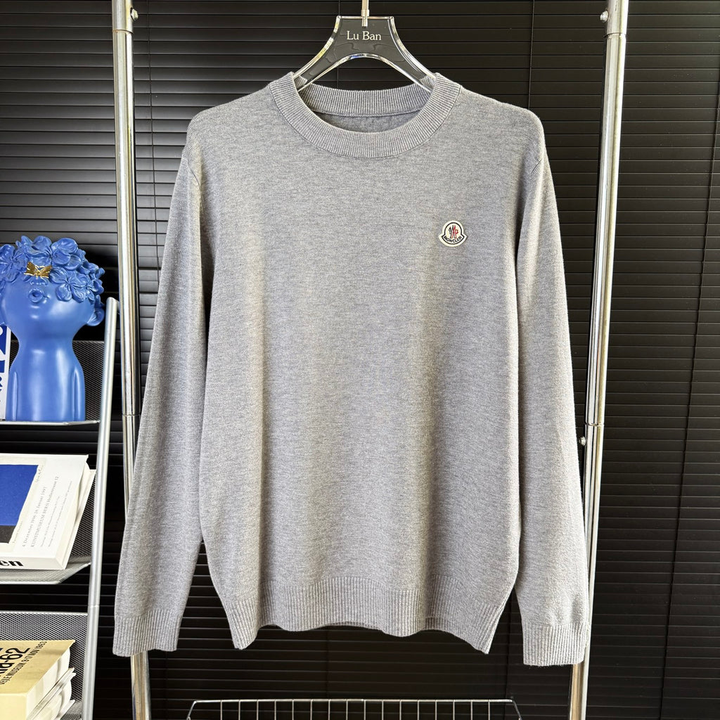 Gray crewneck knit sweater with small Moncler patch on chest
