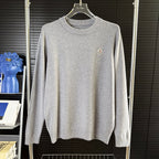 Gray crewneck knit sweater with small Moncler patch on chest