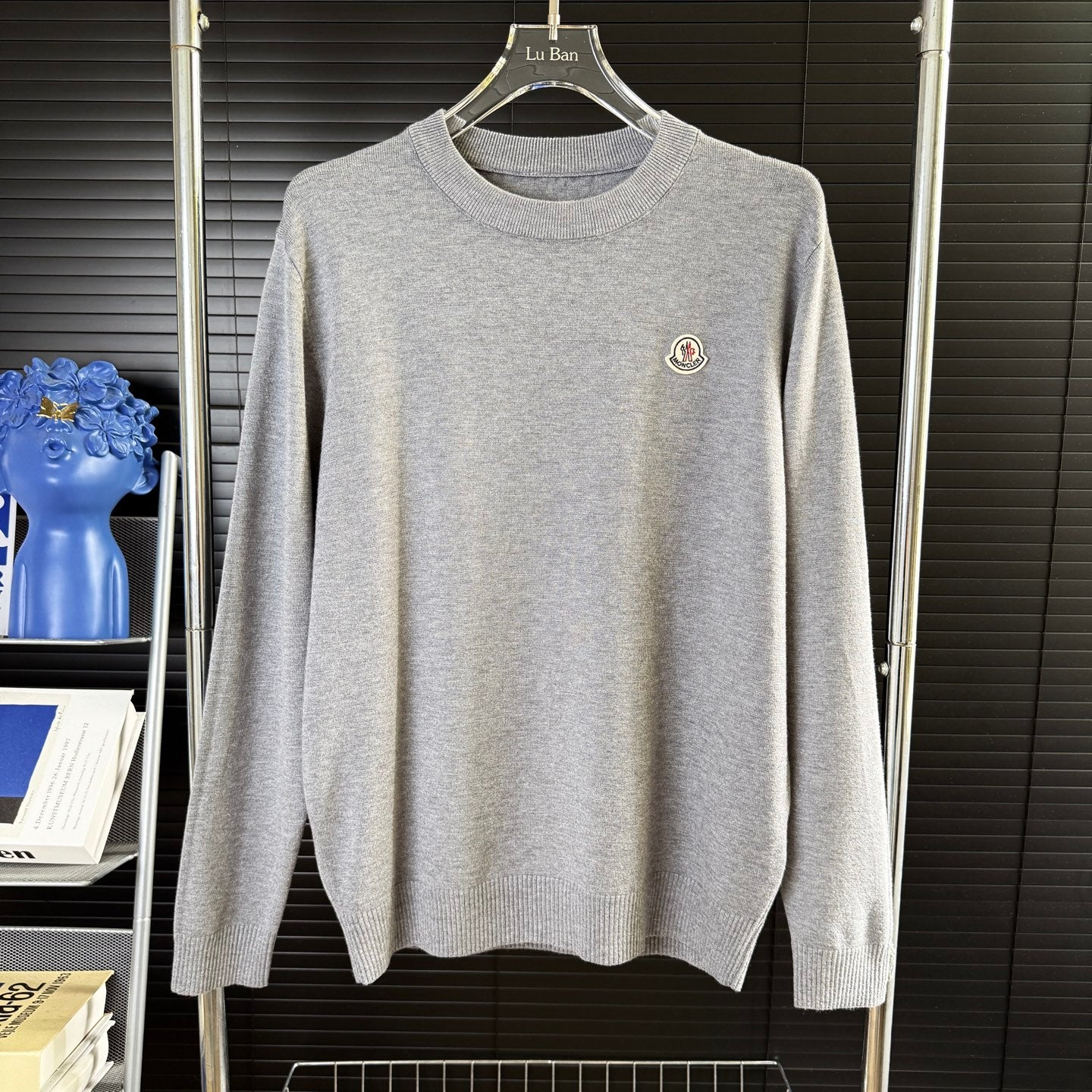 Gray crewneck knit sweater with small Moncler patch on chest